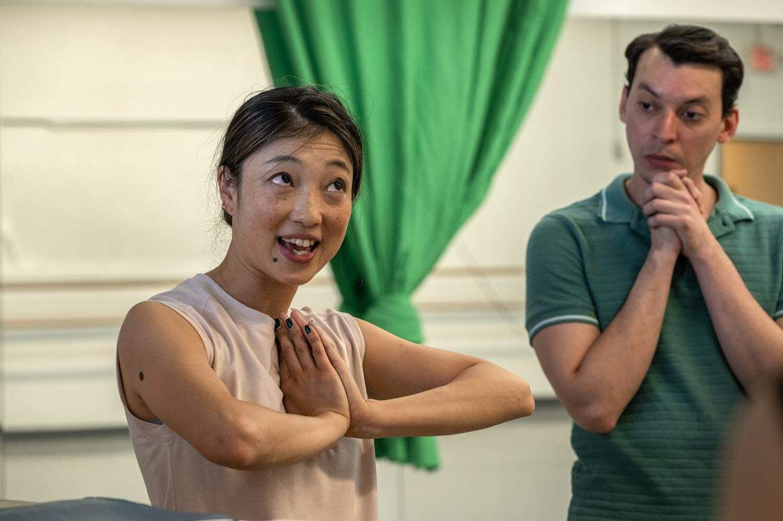 Sacramento Ballet dancer and choreographer Kaori Higashiyama thanks ballet dancers after a dress rehearsal for a children’s ballet she choreographed called “Tanabata,” based on a Japanese fairytale she grew up with on Wednesday, June 21, 2023. At right is dancer Jaime Orrego who plays the father figure in the ballet.