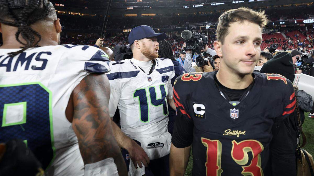 Quarterback Brock Purdy (13) of the San Francisco 49ers shakes hand with quarterback Sam Darnold (14) of the Seattle Seahawks following a game at Levi's Stadium on Saturday in Santa Clara. The Seattle Seahawks defeated the San Francisco 49ers 13-3.
