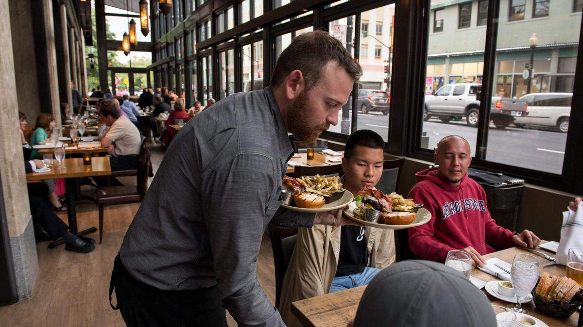 Evan de Bie and Hannah Mayfield, both of Sacramento, enjoy the Sunday Brunch at Capitol Garage in 2010. The restaurant is among more than 120 local businesses participating in the city of Sacramento’s Shop 916 program.