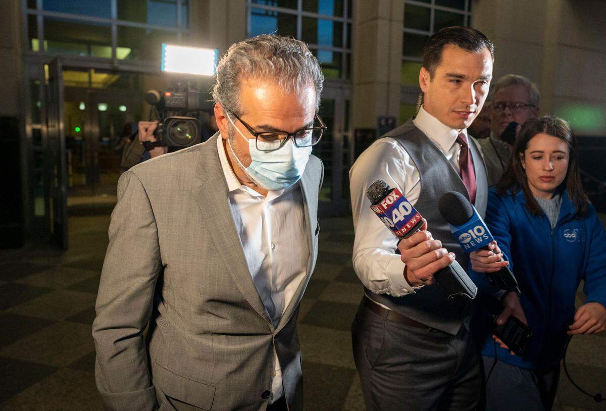 Sacramento City Councilman Sean Loloee is questioned by news reporters but had no comment as he leaves the Robert T. Matsui Federal Courthouse on Friday after being indicted by a federal grand jury on 25 charges, including conspiracy to defraud the U.S. Department of Labor, connected to his Viva Supermarket locations in the capital region.
