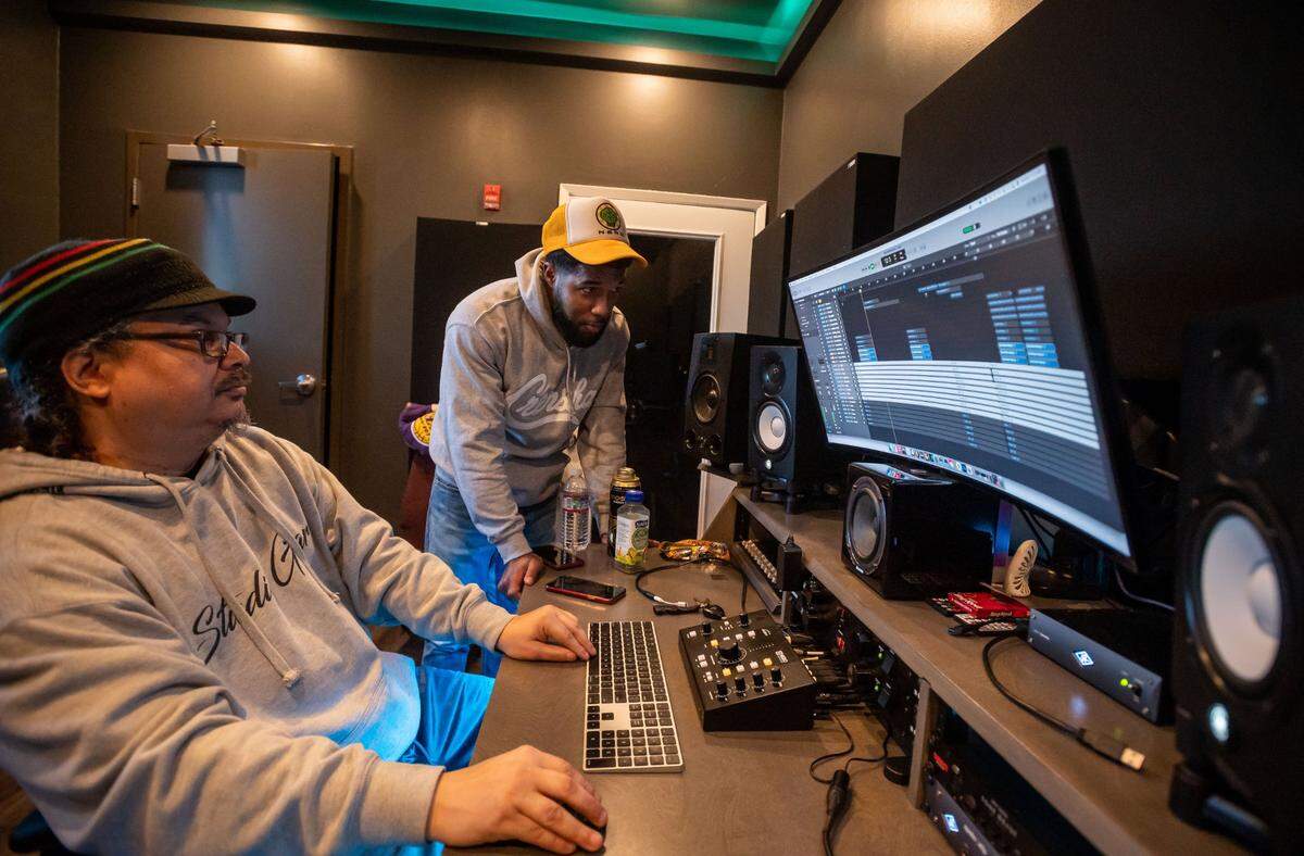 Baba Zoo, head studio engineer and manager at the Guild Studio, plays music for Sacramento-based R&B singer Jeaux, whose music he produces, earlier this month at the Guild Theater in Oak Park.