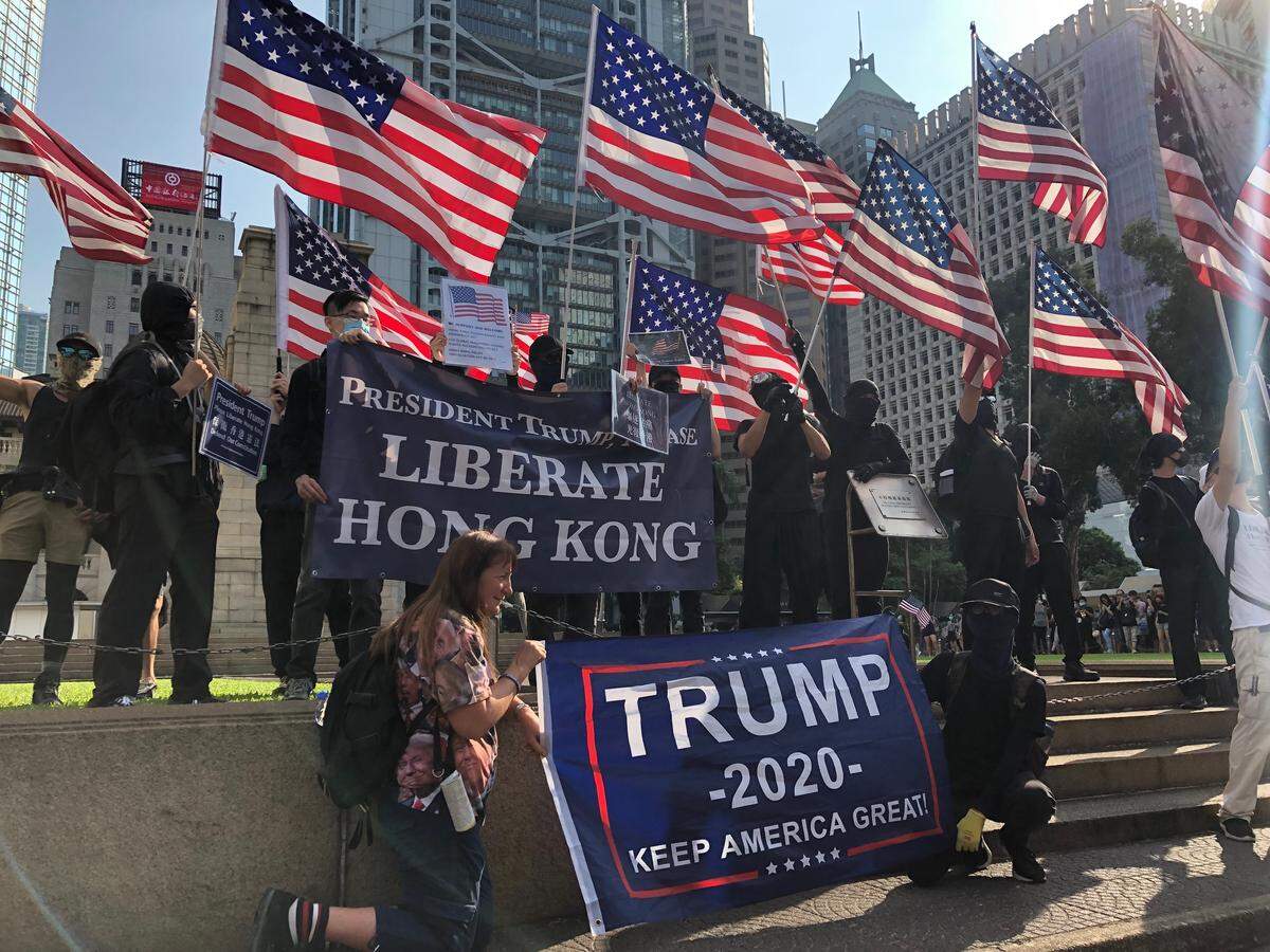 Hong Kong protesters holding U.S. flags on September 15 in Central.