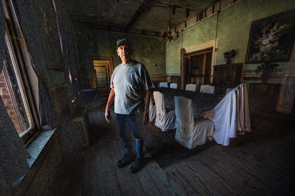 Karl Knobelauch, president of the nonprofit Preston Castle Foundation, stands last month in the formal dining room at Preston Castle was where staff had their meals.