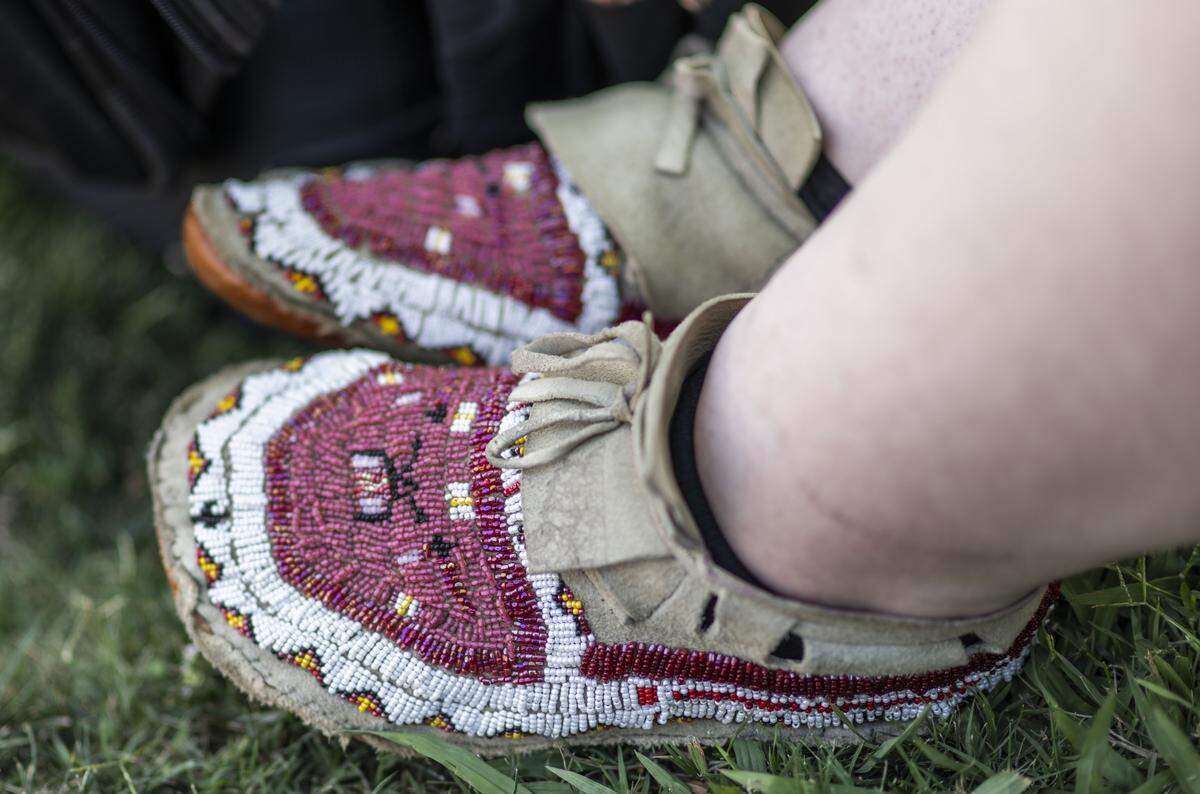 Sage Noelle Tellez Ortiz makes some of the items she uses during her dancing, like her moccasins.