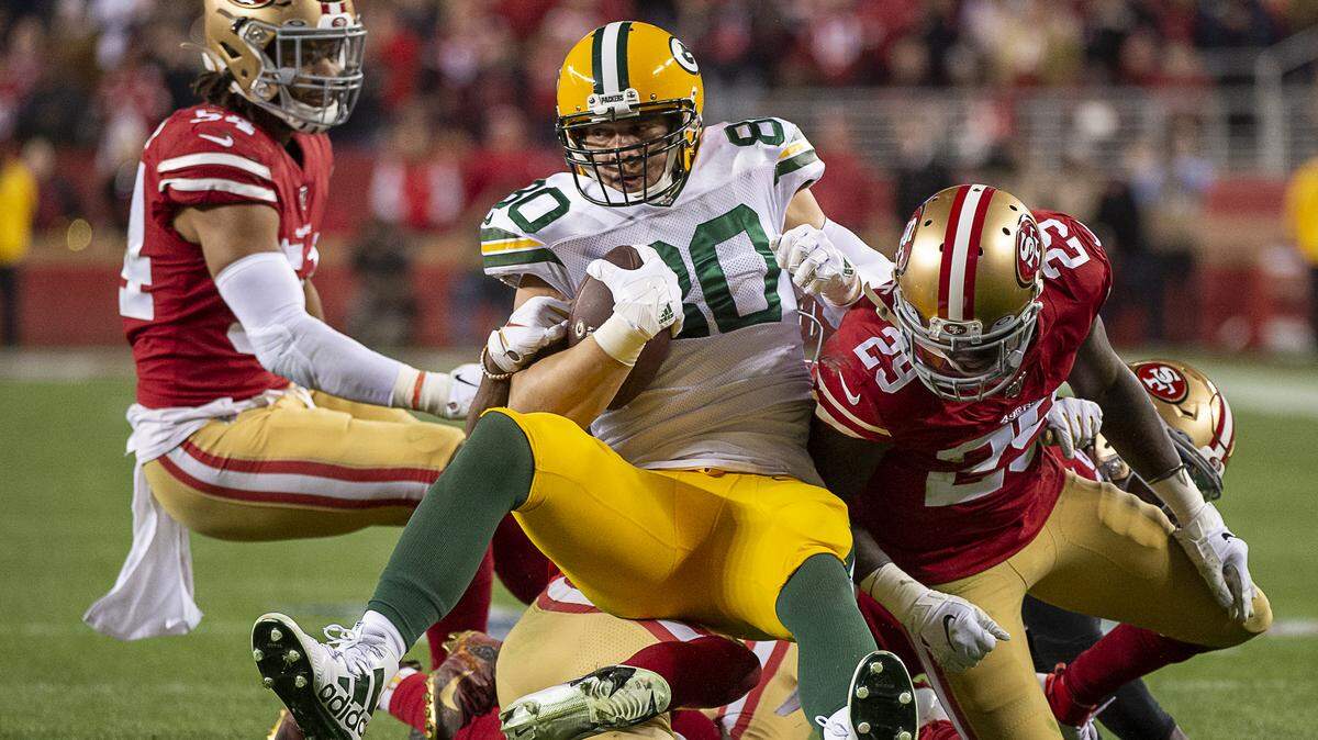 San Francisco 49ers strong safety Jaquiski Tartt (29), middle linebacker Fred Warner (54) and cornerback Richard Sherman (25) tackle Green Bay Packers tight end Jimmy Graham (80) in the fourth quarter during the NFC Championship at Levi’s Stadium on Sunday, Jan 19, 2020 in Santa Clara.