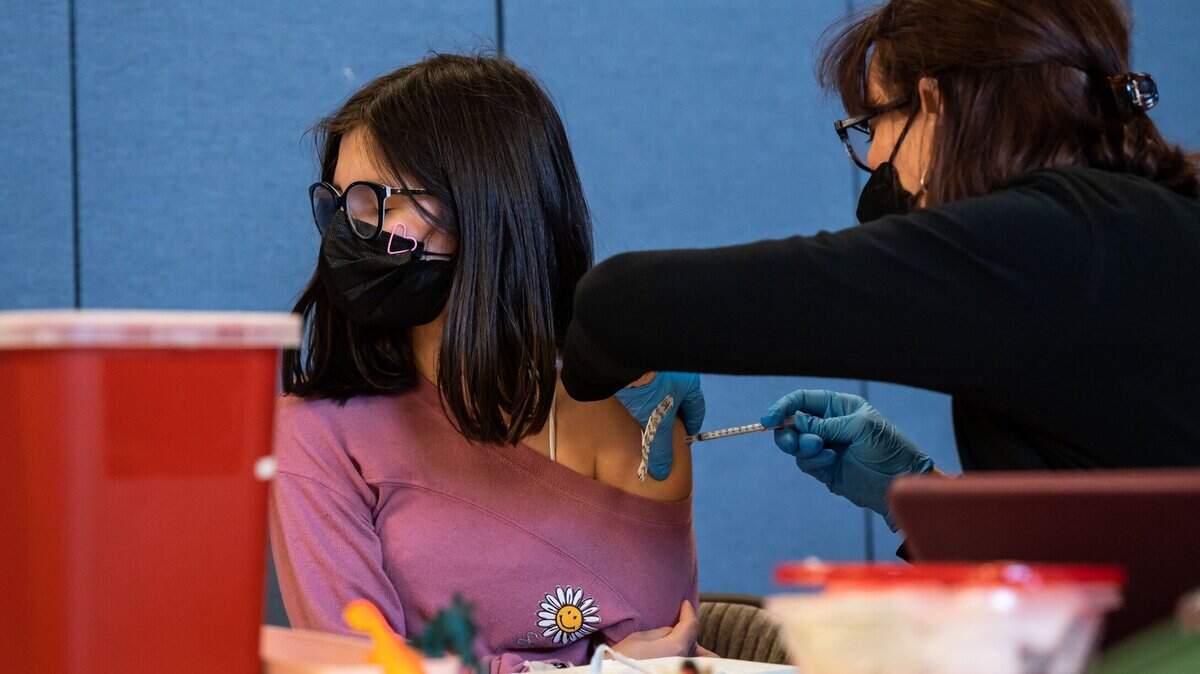 Marianne Figueroa, 11, gets her second COVID-19 vaccine shot in February.