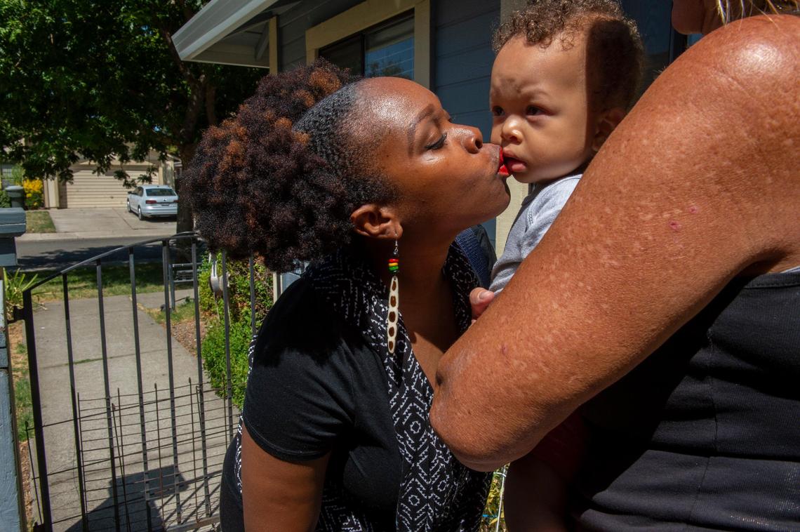 Racquel A. Payton, 30, kisses son Yahir, 1, as she dropped him off at daycare, Tuesday, Aug. 20, 2019 in Sacramento. She said she is very thankful it’s located a few blocks from where she lives. She said that her child care costs are $40 a day.