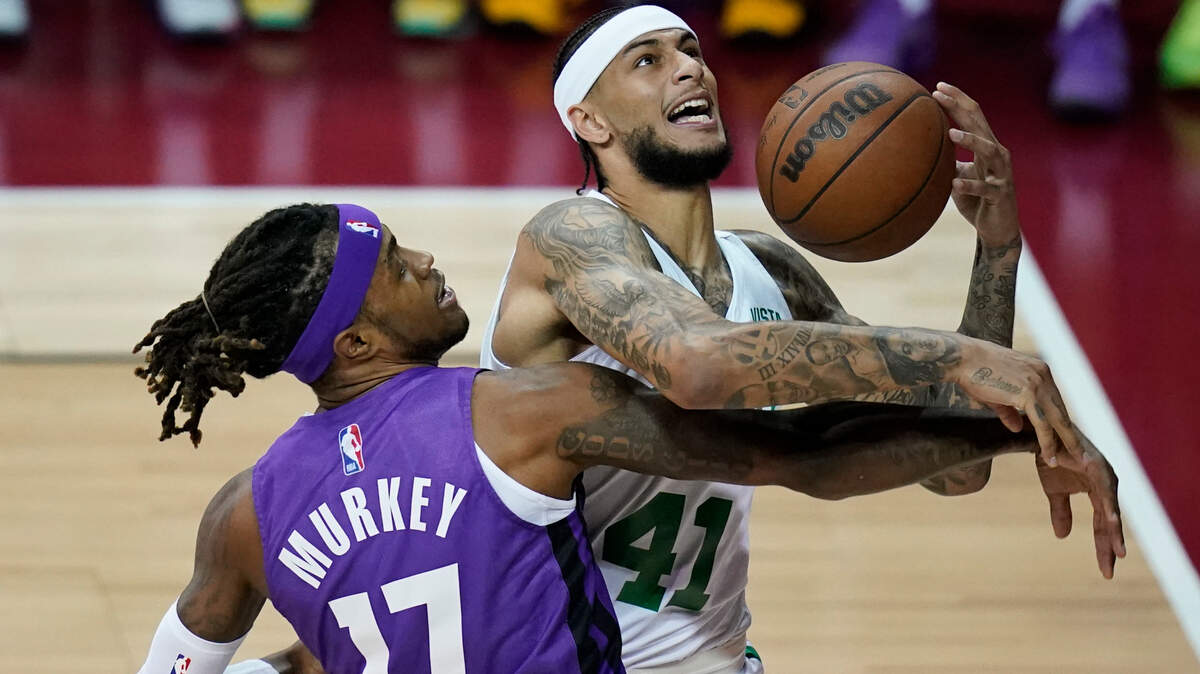 Sacramento Kings’ Ade Murkey and Boston Celtics’ Zach Auguste battle for the ball during the first half of the NBA summer league championship basketball game Tuesday, Aug. 17, 2021, in Las Vegas. (AP Photo/John Locher)