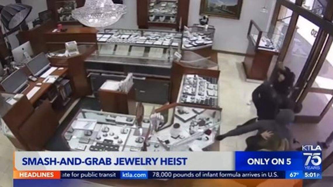 Employees at a Huntington Beach, California, jewelry store fight off thieves armed with hammers in a dramatic security video.