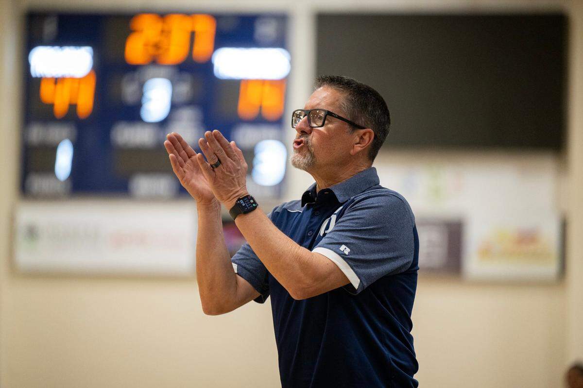 Oak Ridge Trojans coach Stephen White shouts directions to his players in a game against the St. Francis Troubadours on Feb. 7 in El Dorado Hills.
