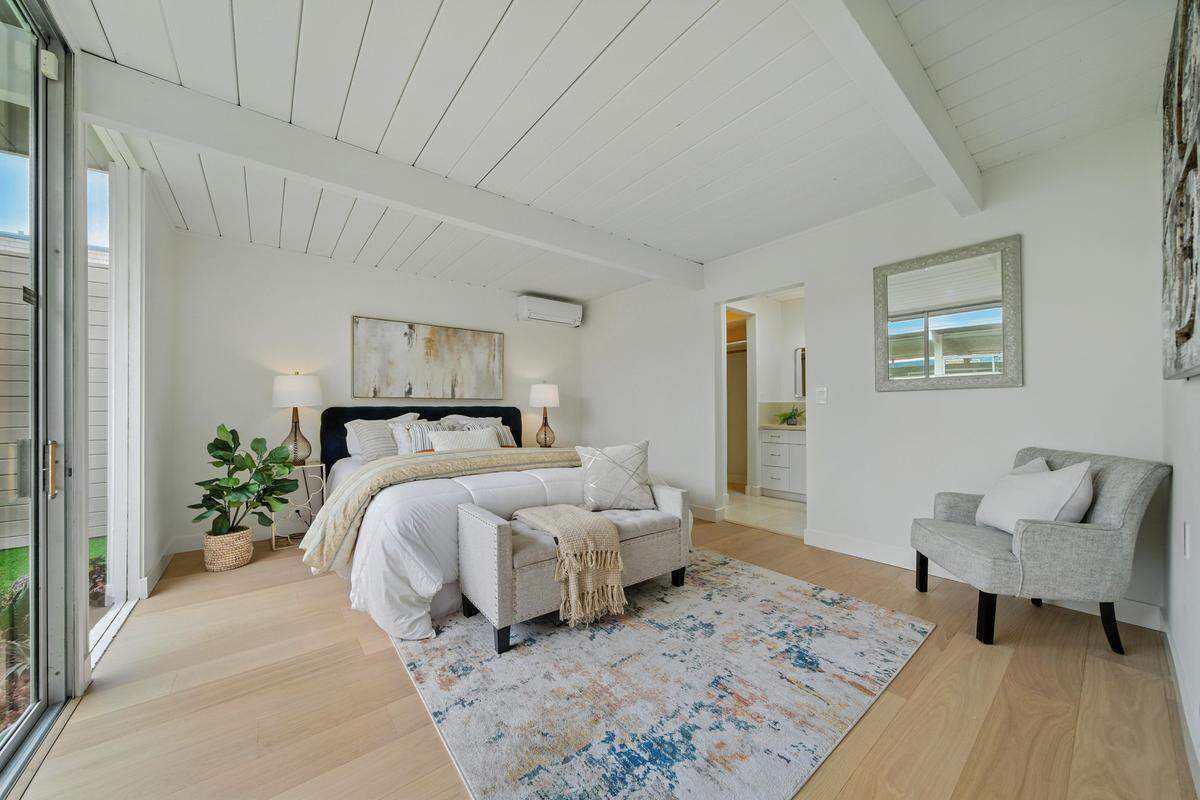 “All four bedrooms are tucked at the rear for privacy, each with garden views. The primary suite includes an ensuite bath, and two additional full baths serve the home.”