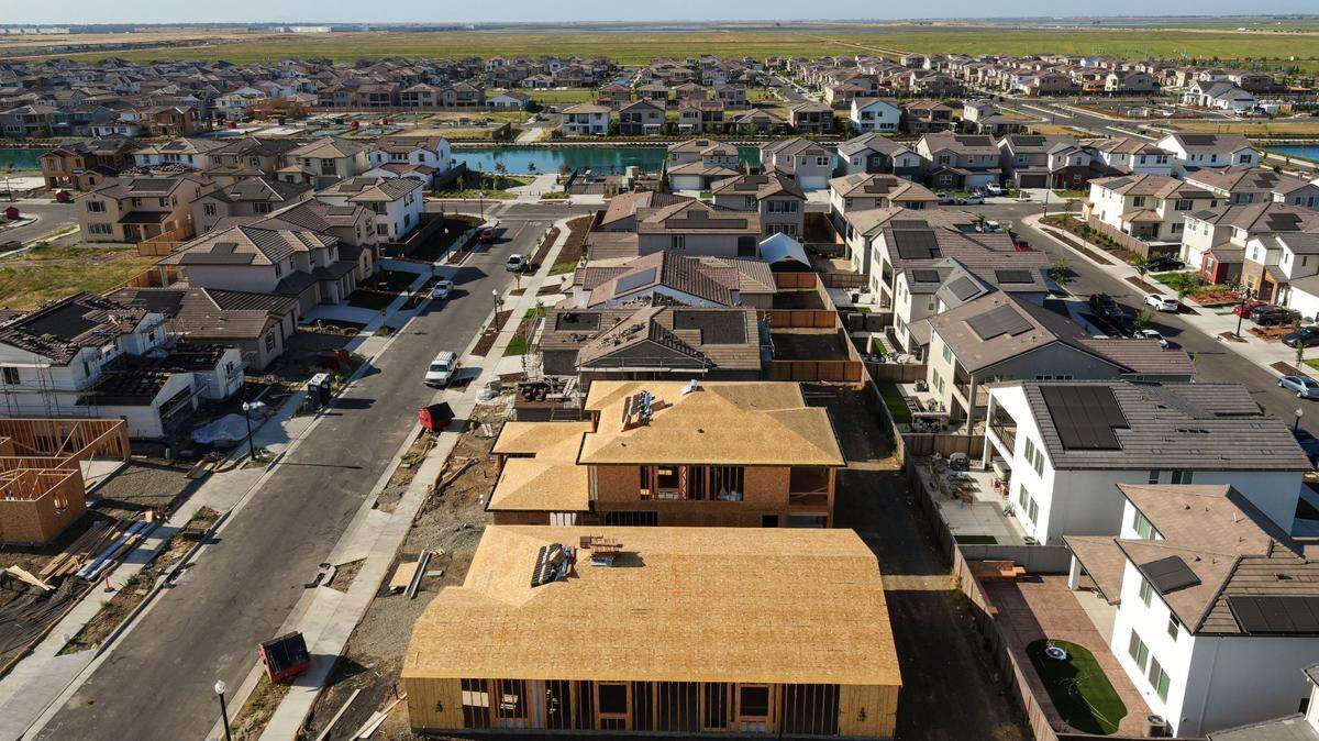 New construction rises near finished homes and models in the Northlake planned community, located near Sacramento International Airport in the far northwest tip of the city, in June. 