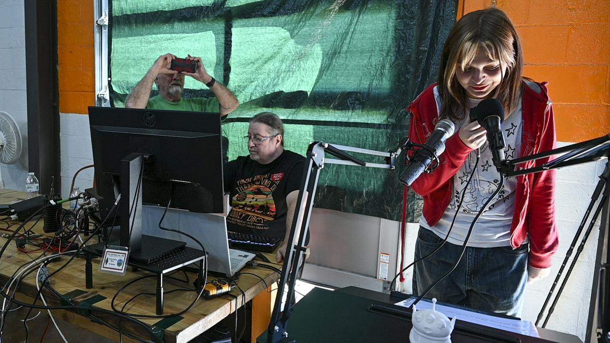 Kennedy, a member of Sacramento Girl Scouts Troop 1089, uses microphones Saturday to ask a question she will ask an astronaut on the International Space Station next week. The scouts were testing out the ham radio they built with the River City Amateur Radio Communications Society after being selected for the STEM program by The National Aeronautics and Space Administration.