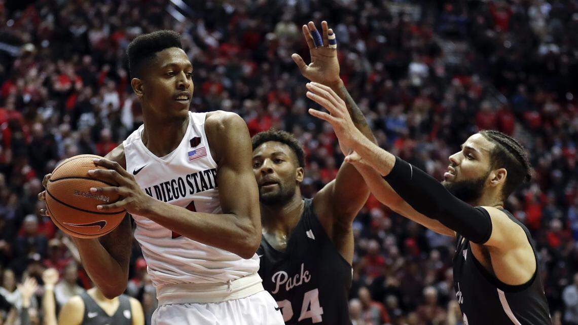 San Diego State forward Malik Pope, left, has scored more points than any Aztecs player in Mountain West Conference Tournament history.