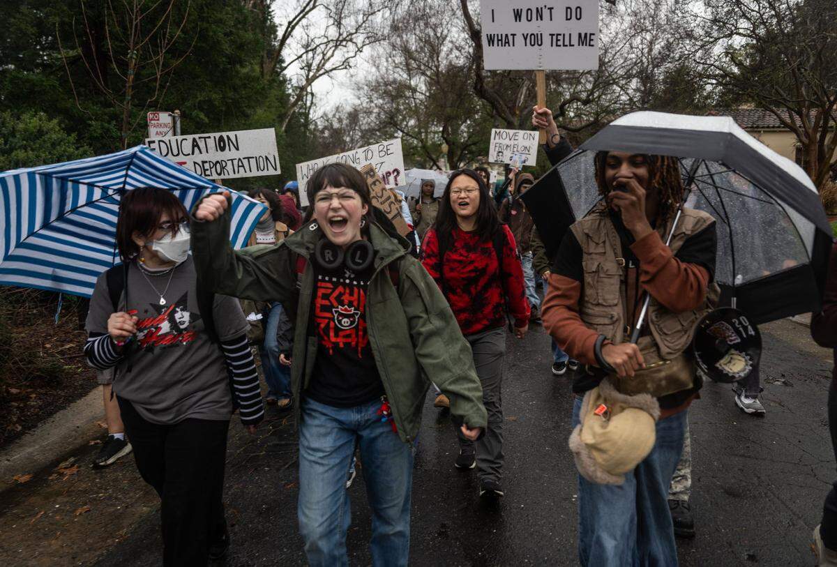 Protest organizer Chaston “Chaz” Guathier-Jones, right, leads students from McClatchy High School during a walk-out on Thursday in Sacramento to protest President Donald Trump’s executive orders.