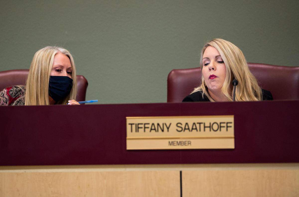 Julie Hupp, left, confers with Tiffany Saathoff, right, at a Rocklin Unified School District Board of Education meeting in 2021. The two now form part of a conservative majority on the board.