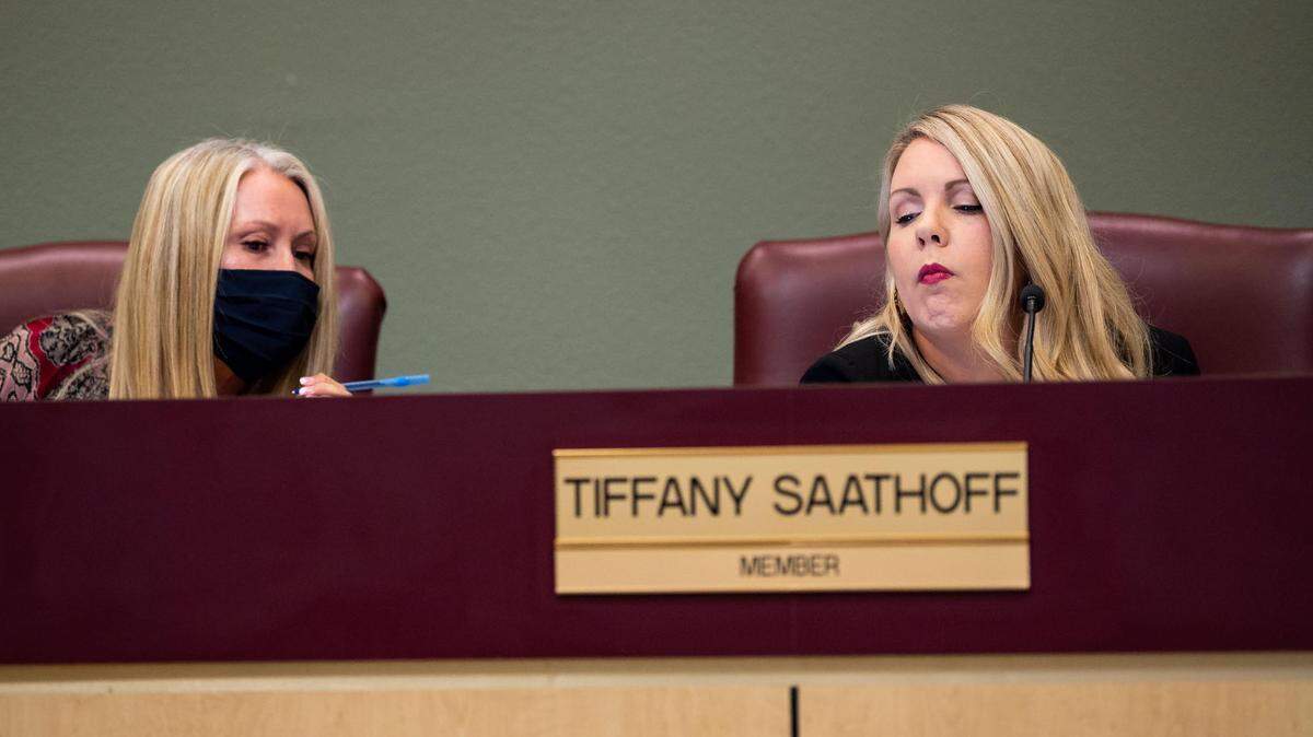 Julie Hupp, left, confers with Tiffany Saathoff, right, at a Rocklin Unified School District Board of Education meeting in 2021. The two now form part of a conservative majority on the board.