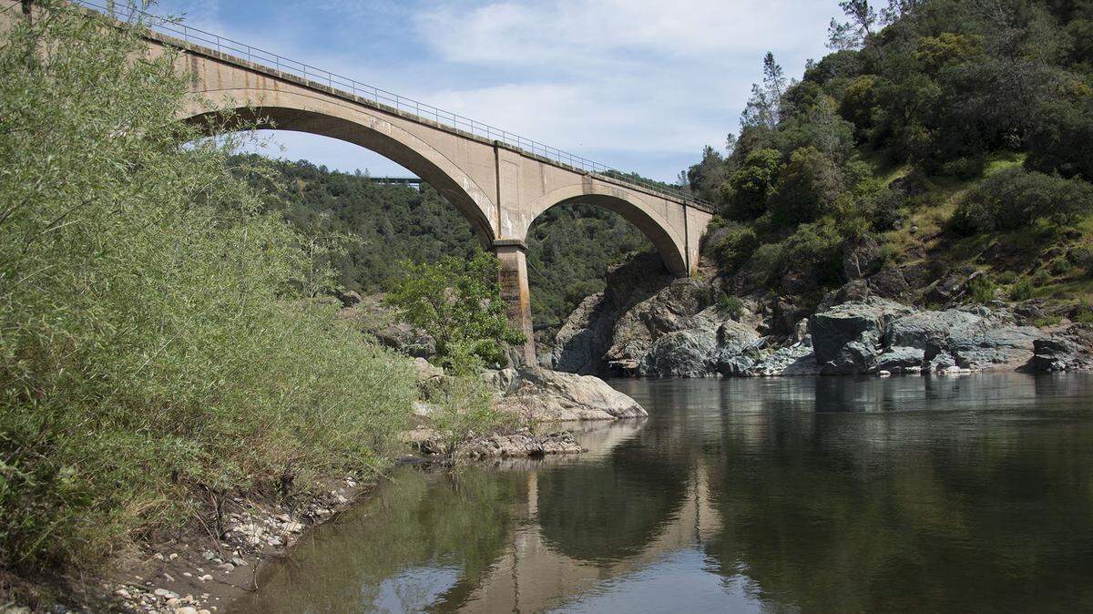 The Mountain Quarries Bridge, popularly known as the “No Hands Bridge” extends over the American River just below the confluence of the north and middle forks on Tuesday, April 26, 2016 in Auburn, Calif.
