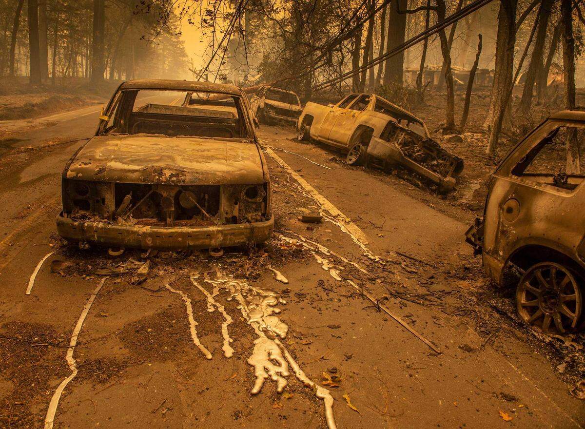 The charred remains of vehicles sit on Pearson Rd. on Friday Nov. 9, 2018, where at least 5 were killed in cars while trying to flee flames as the Camp Fire devastated the town of Paradise, Calif. The photograph won fifth place in the news photo category at the California Newspaper Publisher Association’s annual awards.