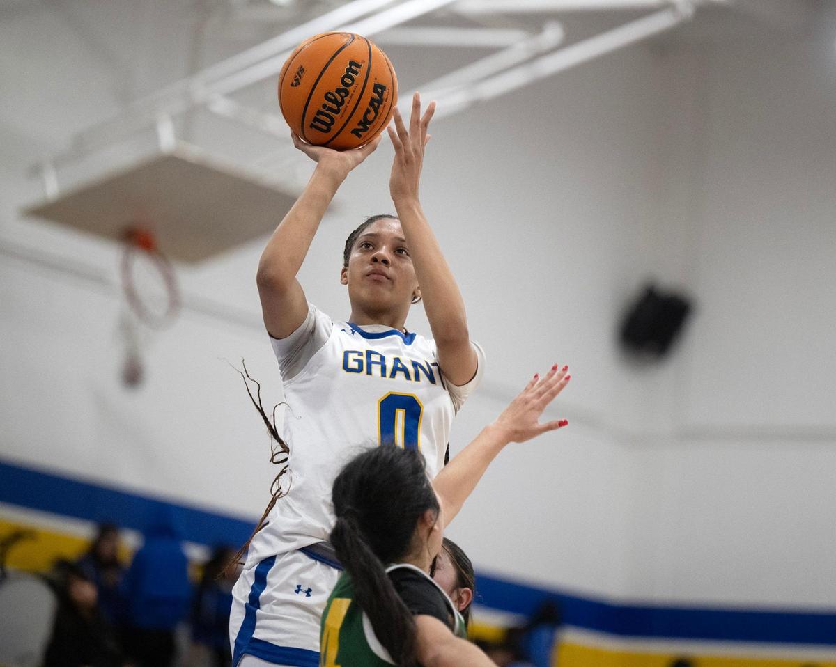The Grant Pacers’ Asia Washington (0) shoots over a Kennedy Cougars defender last month in Del Paso Heights.