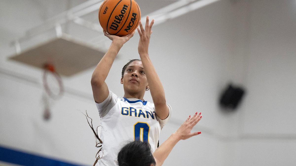 The Grant Pacers’ Asia Washington (0), a sophomore, shoots over a Kennedy Cougars defender last month in Del Paso Heights.