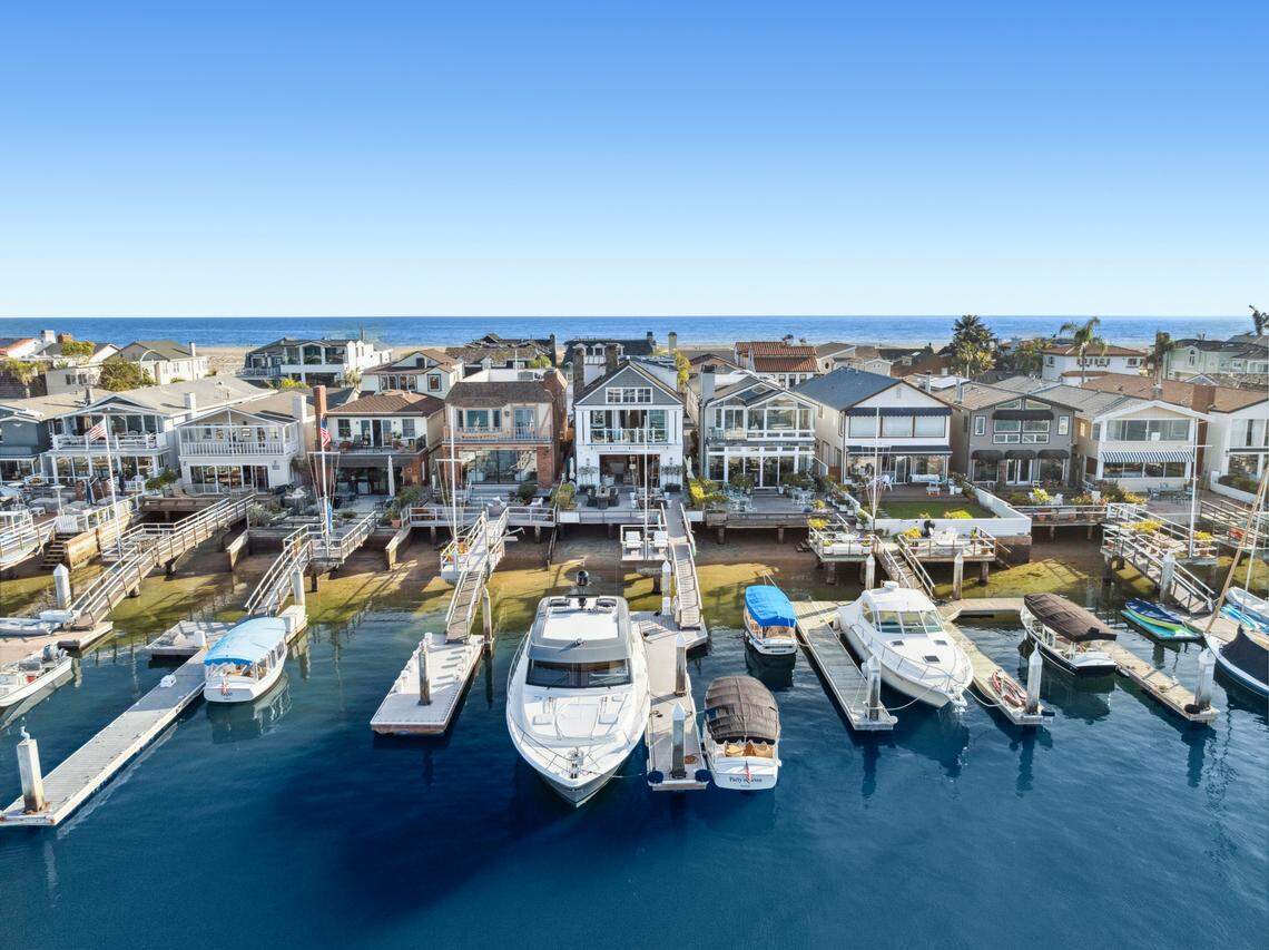 Other highlights of the $13.5 million Newport Beach home include a rooftop deck with a spa, bayfront terrace, backyard firepit and private dock.