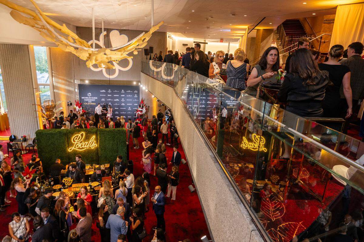 Guests enjoy food and cocktails before at the Michelin Guide California 2025 Ceremony on Wednesday, June 25, 2025, at the SAFE Credit Union Performing Arts Center. Localis and The Kitchen, the top Sacramento restaurants in the guide, had food stations in the venue’s lobby.