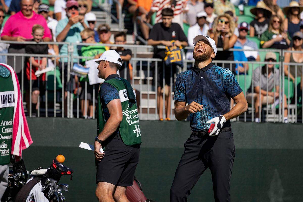 Golden State Warriors star Stephen Curry laughs with his caddie before teeing off on the first hole on the final day of the American Century Celebrity Golf Championship Tournament on Sunday, July 10, 2022, at Edgewood Tahoe Golf Course in Stateline, Nev.