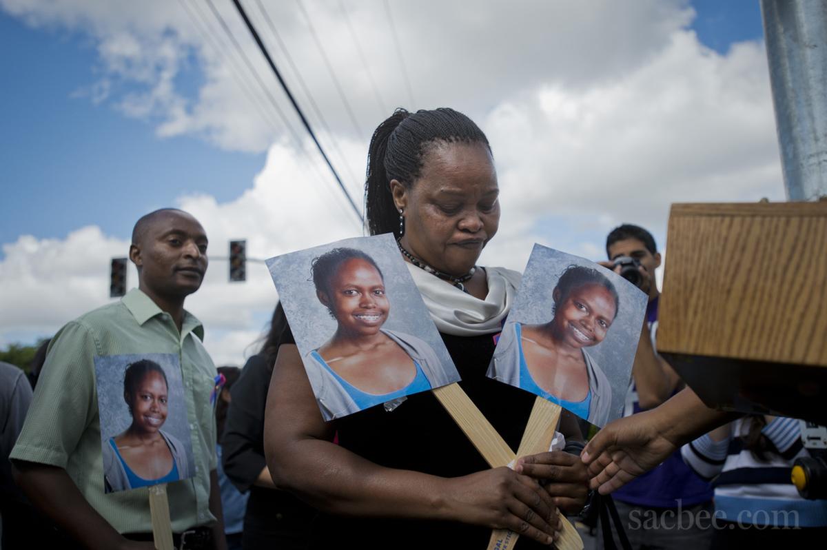 Mary Murigi carries pictures of her daughter Michelle at a Sacramento City Unified press conference celebrating a new traffic signal on May 9, 2014. Murigi’s daughter was killed in 2012 while crossing Fruitridge Road on her way to school.