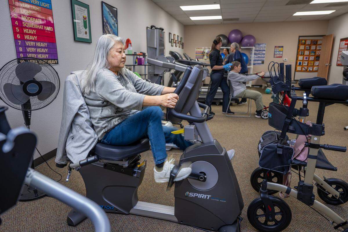 Hideko Yamada of Sacramento works out on recumbent bike at the John A. Schafer, MD, Multiple Sclerosis Achievement Center on Nov. 14, in Citrus Heights. The center is asking Book of Dreams readers for donations to acquire new bike machines.