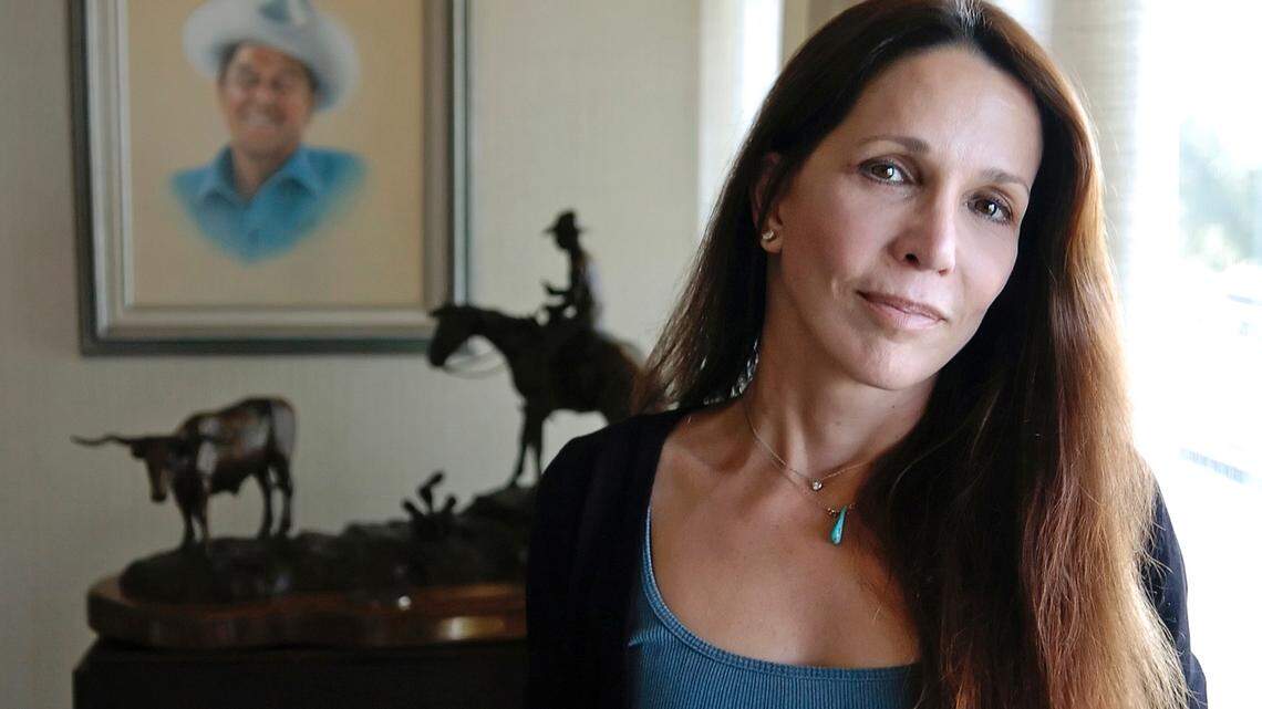Patti Davis, daughter of late U.S. president Ronald Reagan and Nancy Reagan, poses near artwork given to the resident at the Ronald Reagan Presidential Library in Simi Valley, Calif., in 2004.
