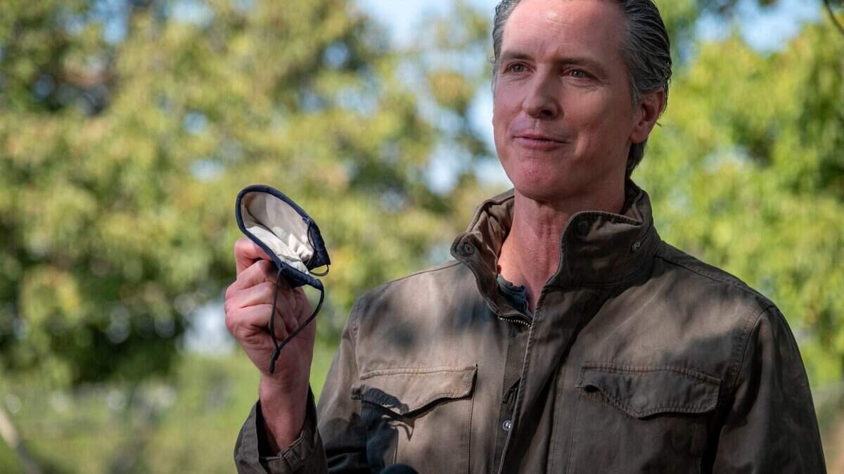 California State Governor Gavin talks about the importance of wearing a face mask during a press conference at Sierra Orchards walnut farm in Winters in Solano County on Wednesday, Oct. 7, 2020.