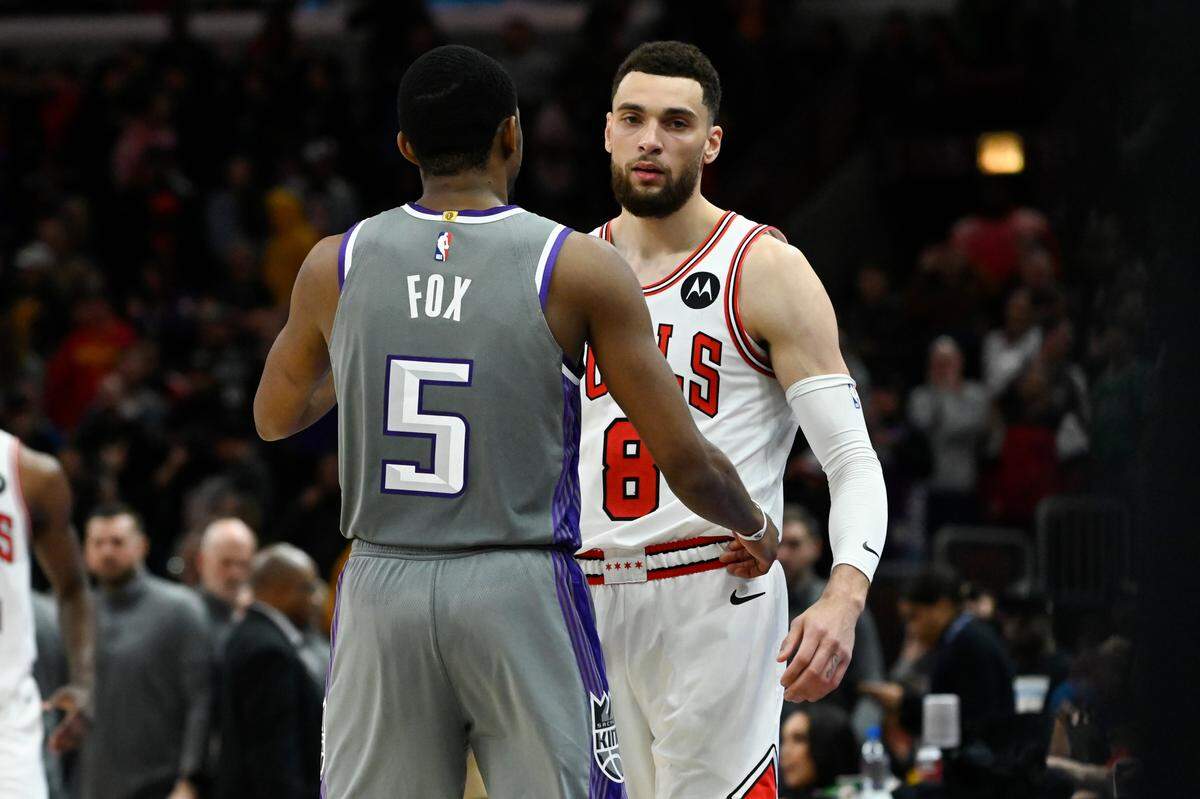 Sacramento Kings guard De’Aaron Fox (5) and Chicago Bulls guard Zach LaVine (8) talk after a game on March 15, 2023, at the United Center in Chicago. The Kings reportedly traded Fox to the San Antonio Spurs on Sunday and received LaVine in a three-team deal with the Bulls.
