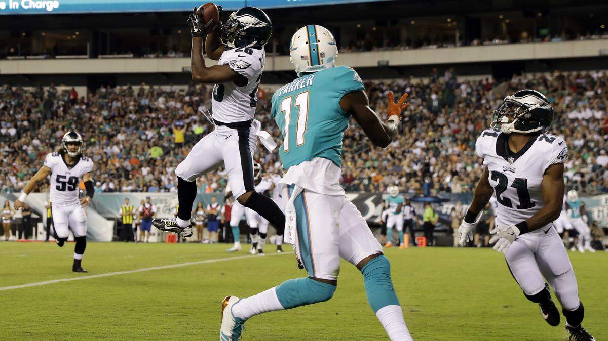 Philadelphia Eagles' Jaylen Watkins (26) pulls in an interception against Miami Dolphins' DeVante Parker (11) during the first half of a preseason NFL football game, Thursday, Aug. 24, 2017, in Philadelphia.