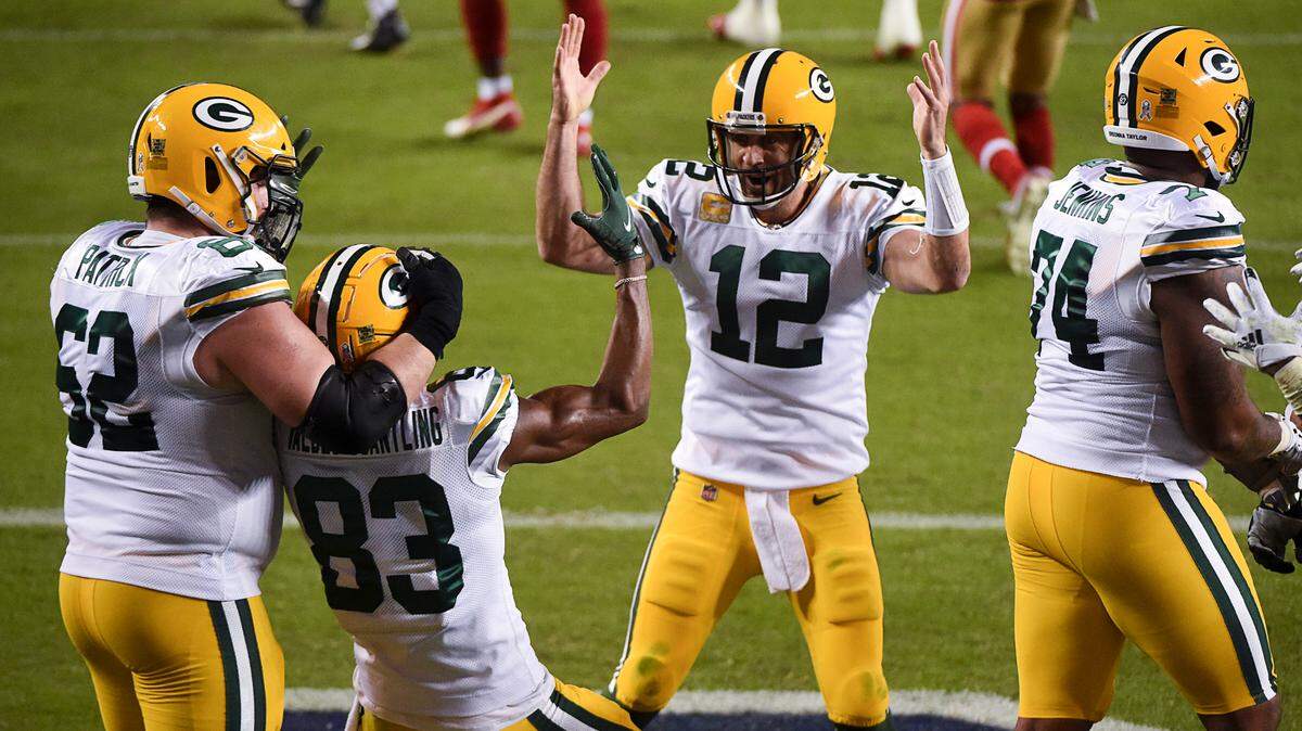 Green Bay Packers quarterback Aaron Rodgers (12) celebrates a touchdown pass with Green Bay Packers wide receiver Marquez Valdes-Scantling (83) in the third quarter during a game at Levi’s Stadium on Thursday, Nov. 5, 2020, in Santa Clara.