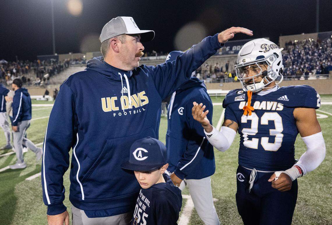 UC Davis Aggies head coach Tim Plough talks tight end Winston Williams (23) after their 30-28 loss to Montana State Bobcats during a NCAA football game on Saturday at UC Davis Health Stadium.