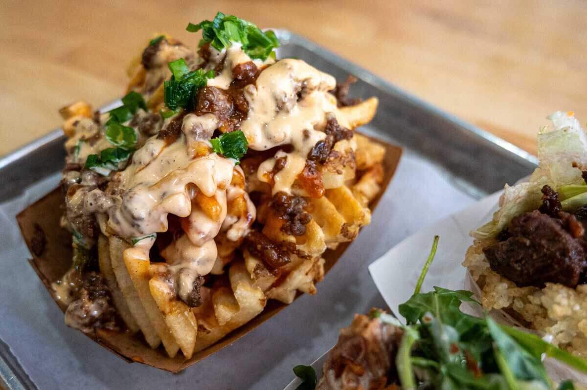 The Kamikaze Fries are made with minced Korean barbecue beef, Japanese mayo and gochujang sauce over waffle fries at Koja Kitchen in downtown Sacramento on Monday.