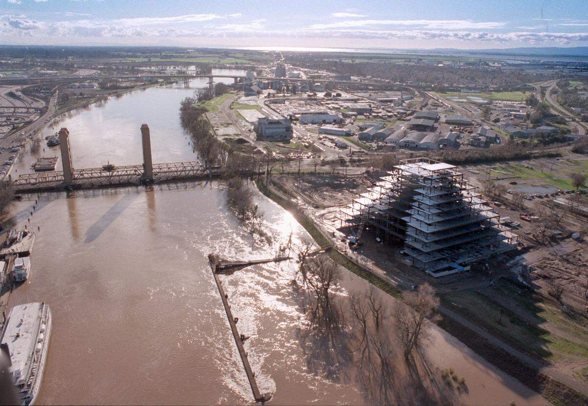 The Money Store pyramid takes shape in West Sacramento in an aerial view looking south as water levels in Sacramento River run high from storms on Jan. 3, 1997.