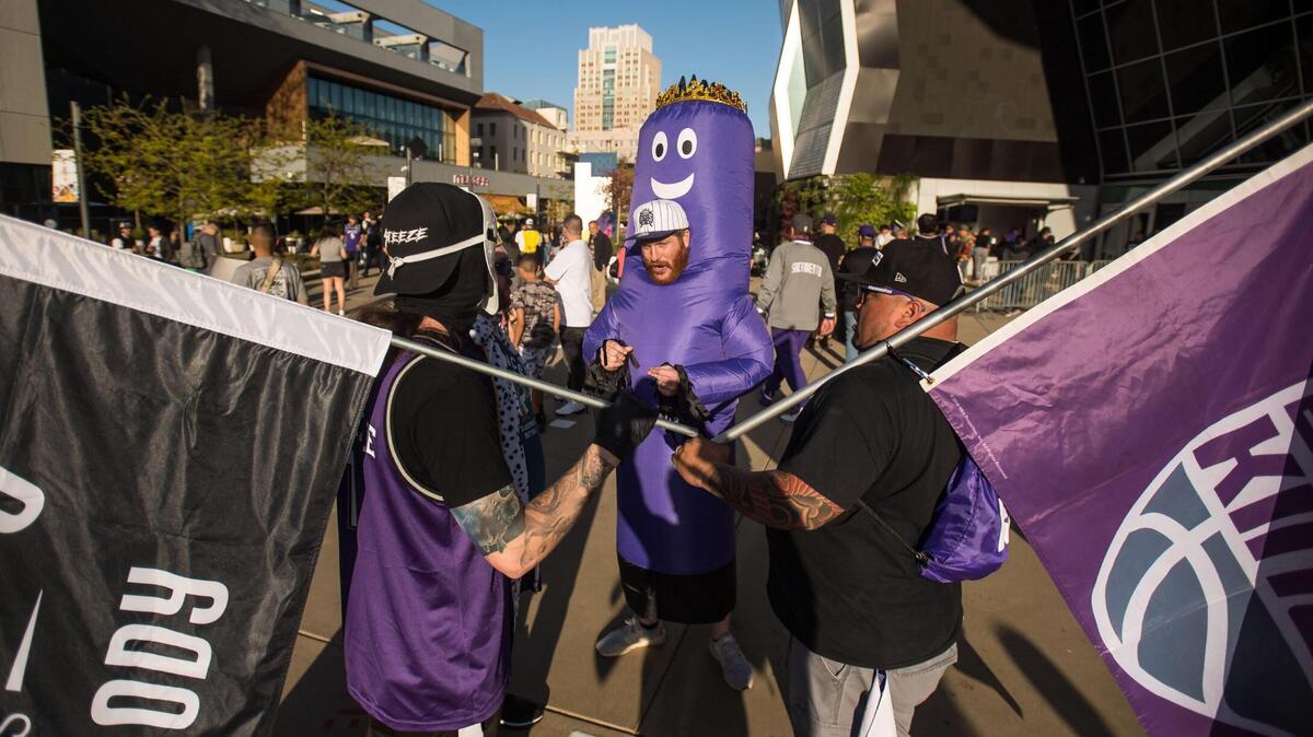 Robert Wood, dressed as “the beam” at center, came up from San Diego to celebrate with fellow Sacramento Kings fans during a rally outside Golden 1 Center on Friday, April 14, 2023, to tip-off the 2023 playoffs. His childhood friend, Sacramento resident Taylor Cummings, said, “This is the renaissance for Sacramento, this the revival of this city — no longer is it just farm to fork, it’s now Fox to Sabonis.”