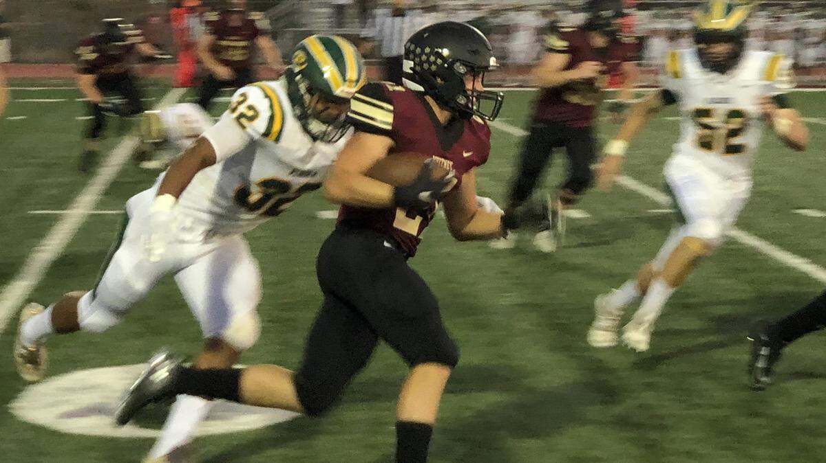 Whitney senior running back Will Fischer rushes the ball during a 47-34 win against Placer on Friday, August 30 at Whitney Stadium. Fischer rushed for an 11-yard touchdown in the victory.