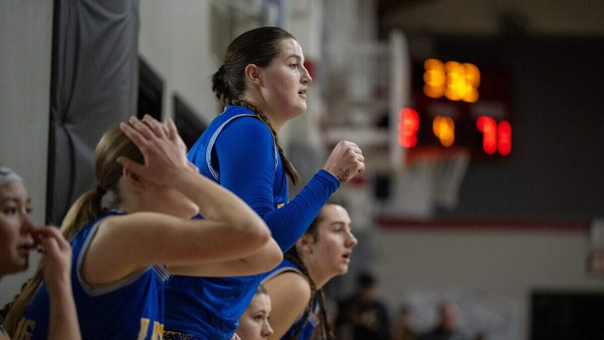 The Faith Christian Lions’ Lauren Harris roots with her teammates in the second half against the Sacramento Adventist Capitals on Tuesday in Carmichael.