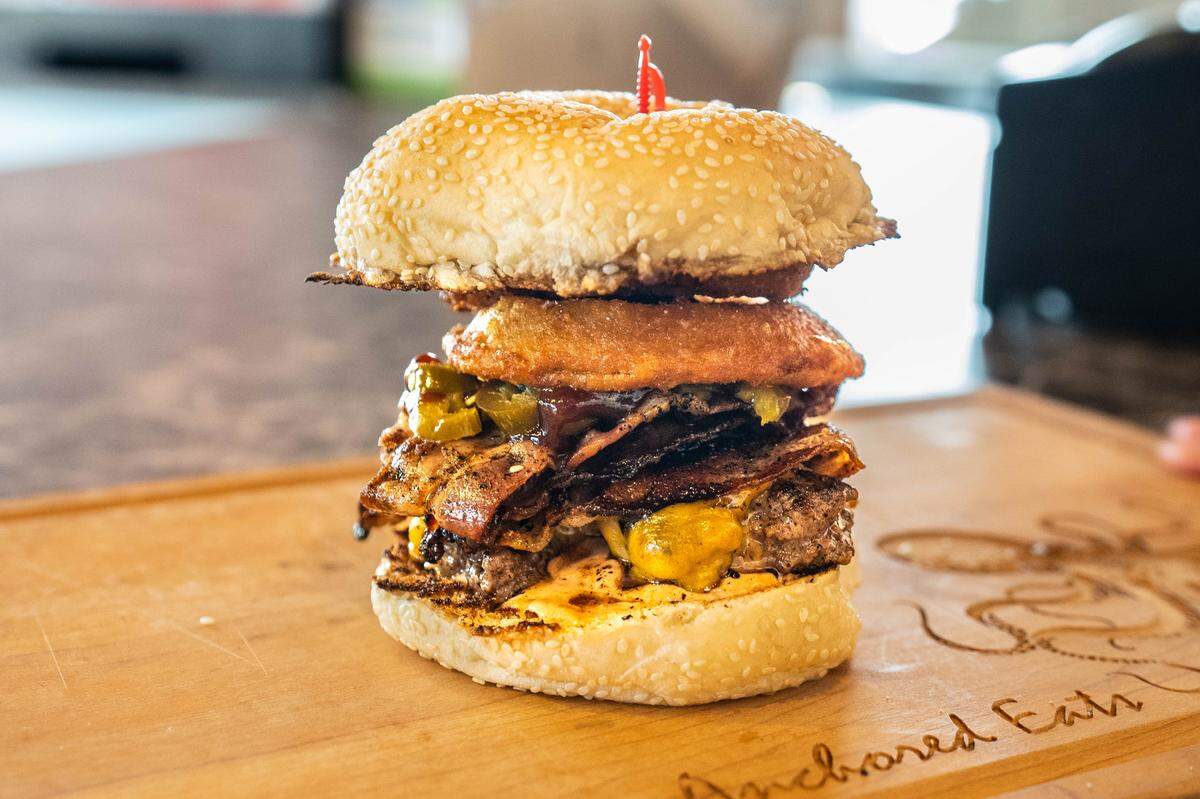 The Yeehaw Burger is one of the more popular items on the menu at Anchored Eats, Thursday, June 15, 2023.