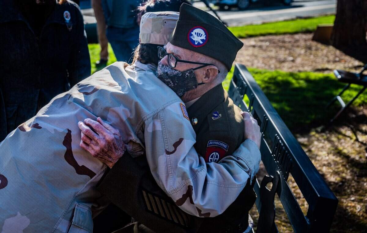 Army veteran Marvin D. Cornett, 99, is hugged by Army Capt. Melany Hall at a ceremony awarding him the Bronze Star Medal and Purple Heart on Monday.