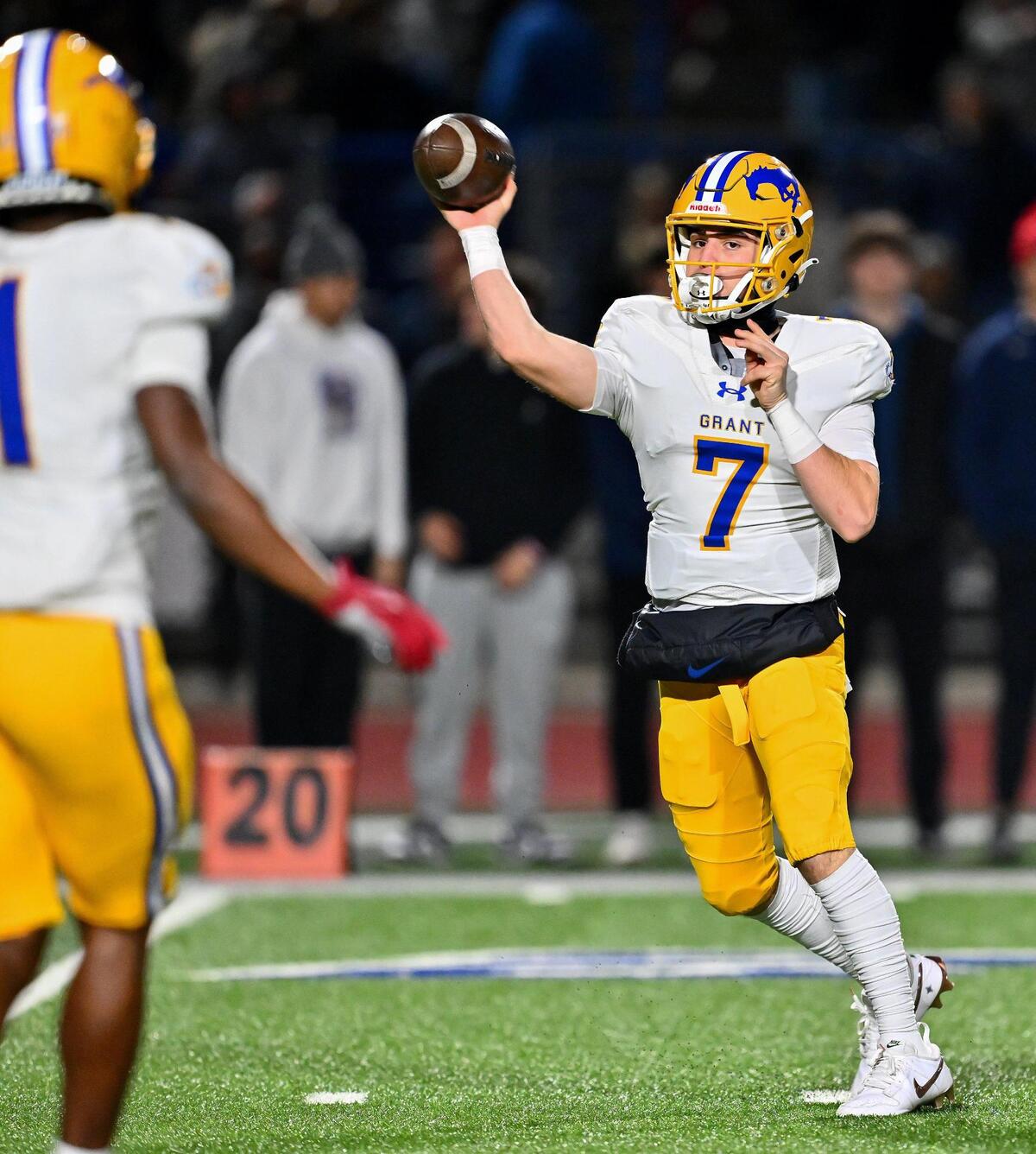 Grant Pacers quarterback Luke Alexander (7) passes the ball to running back Wayshawn Parker (1) for a first-down run in the first half of the CIF Northern California Division 2-AA championship on Friday.
