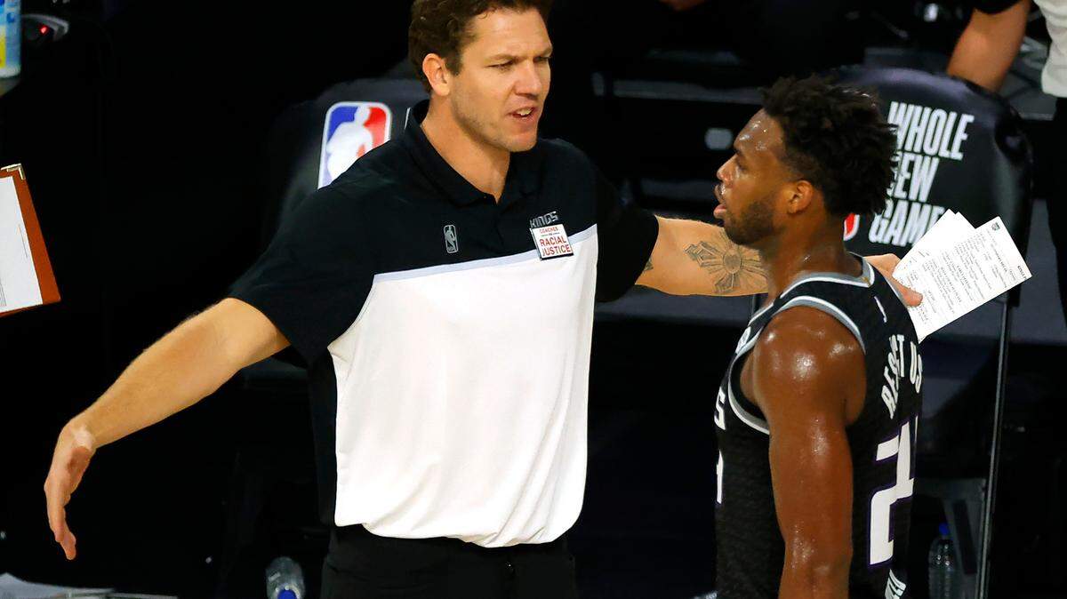 Sacramento Kings head coach Luke Walton, left, talks with Buddy Hield during the fourth quarter of an NBA basketball game against the Los Angeles Lakers, Thursday, Aug. 13, 2020, in Lake Buena Vista, Fla. (Kevin C. Cox/Pool Photo via AP)