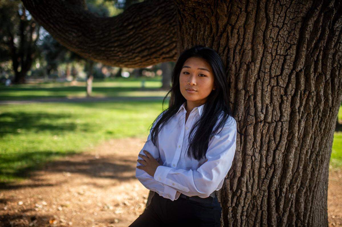 Ashley Jun, a McClatchy High School student, praised Sacramento’s diversity. The city is where “I got to see people who looked like me,” she said. Jun stands for a portrait in Capitol Park in downtown Sacramento on Wednesday, Oct. 7, 2020.