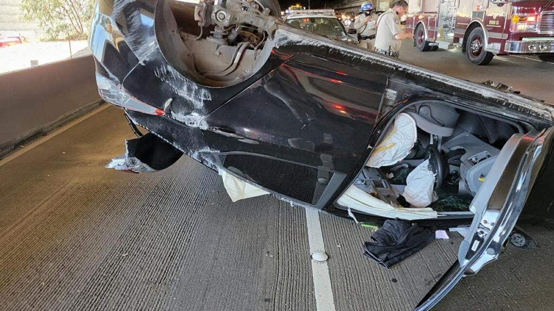 A father briefly distracted by his daughter in the back seat crashed on the San Francisco-Oakland Bay Bridge in California, flipping his car several times.