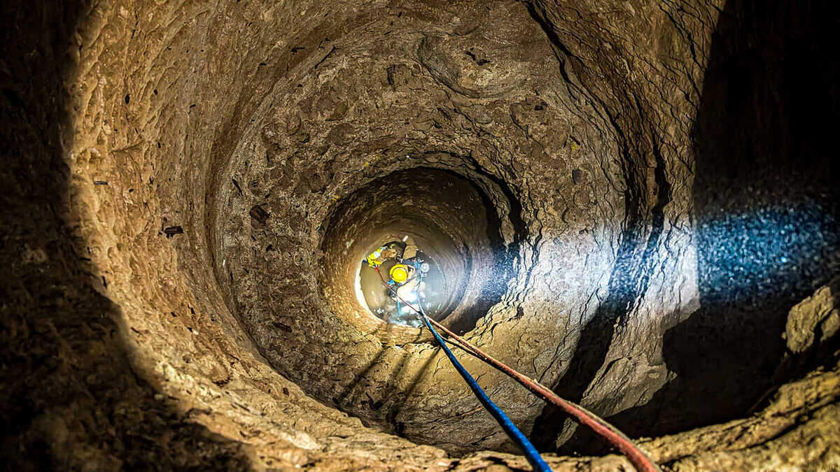 El Dorado County firefighters rescue a dog stuck in a mine shaft near Placerville on Thursday, May 30, 2024. The dog fell down a 60-foot borehole in an abandoned mine shaft, and firefighters spent over an hour conducting the rescue mission.