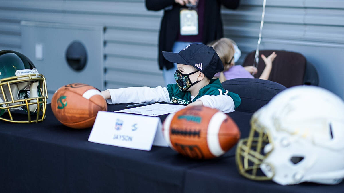 Seven-year-old Jayson Hellman held a signing ceremony with the Sacramento State football team Tuesday.