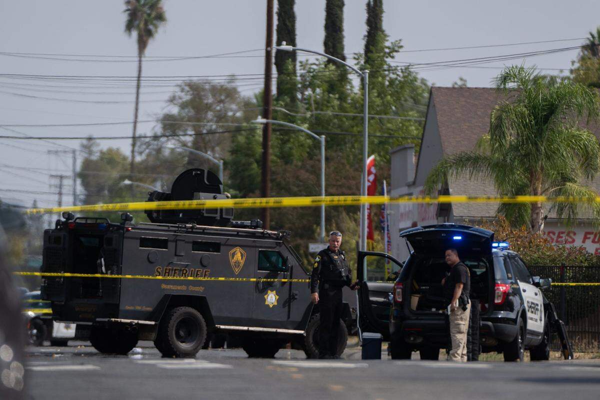 Sacramento Sheriff’s deputies investigate a shooting in south Sacramento in 2022. The Sacramento County Sheriff’s Office says its overtime costs come largely from staffing needs and extra hours for deputies such as homicide investigators.